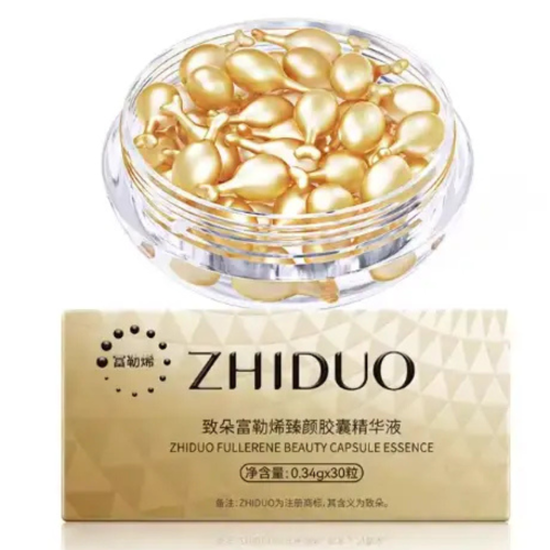 Оптом Підтягуюча капсульна сироватка для обличчя від в'ялості шкіри з фуллереном та антиоксидантами ZHIDUO FULLERENE BEAUTY CAPSULE ESSENCE - 0,34 г * 30 од.
